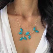 Anthos Leaf Necklace by Carla De La Cruz Jewelry | Turquoise Blue Gold Leaf Necklace | Turquoise Blue Statement Necklace | Floral Necklace | Blue and Gold Necklace